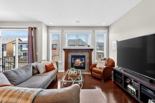 202 Evansridge Circle Nw, Calgary, AB - Indoor Photo Showing Living Room With Fireplace