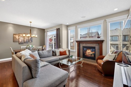 202 Evansridge Circle Nw, Calgary, AB - Indoor Photo Showing Living Room With Fireplace