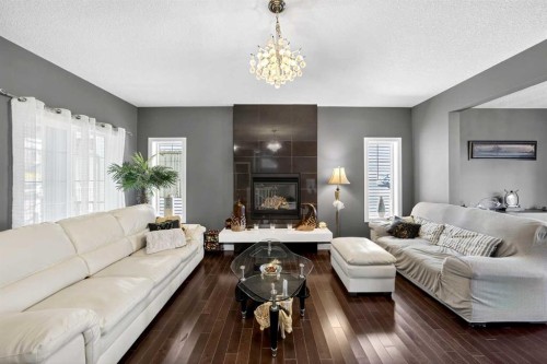 168 Cranford Drive Se, Calgary, AB - Indoor Photo Showing Living Room With Fireplace