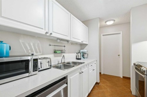 4308-385 Patterson Hill Sw, Calgary, AB - Indoor Photo Showing Kitchen With Stainless Steel Kitchen With Double Sink
