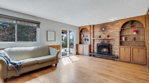 504 Suntree Place, Okotoks, AB - Indoor Photo Showing Living Room With Fireplace