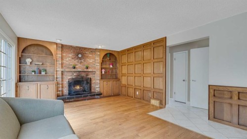 504 Suntree Place, Okotoks, AB - Indoor Photo Showing Living Room With Fireplace