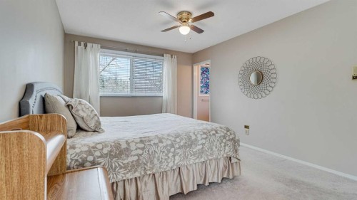 504 Suntree Place, Okotoks, AB - Indoor Photo Showing Bedroom