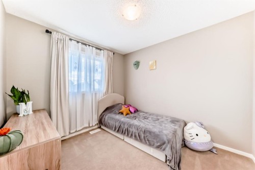 660 Walden Drive Se, Calgary, AB - Indoor Photo Showing Bedroom