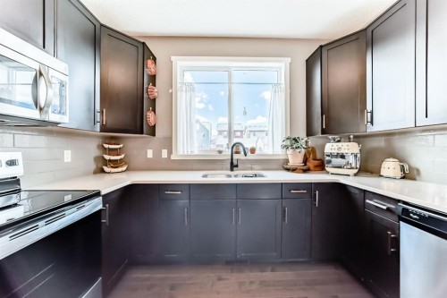 660 Walden Drive Se, Calgary, AB - Indoor Photo Showing Kitchen With Double Sink