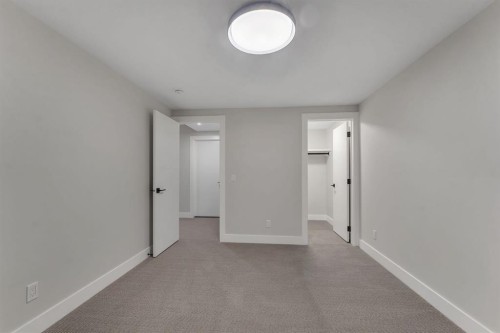 12 Spring Creek Point Sw, Calgary, AB - Indoor Photo Showing Other Room