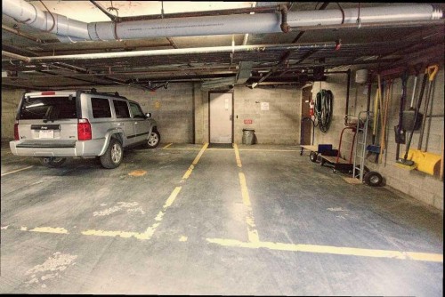 100-808 4 Avenue Nw, Calgary, AB - Indoor Photo Showing Garage
