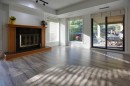 100-808 4 Avenue Nw, Calgary, AB  - Indoor Photo Showing Living Room With Fireplace 