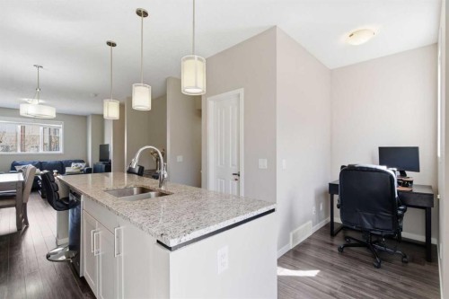 150 Copperpond Villas Se, Calgary, AB - Indoor Photo Showing Kitchen With Double Sink With Upgraded Kitchen