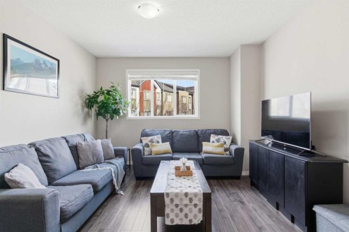 150 Copperpond Villas Se, Calgary, AB - Indoor Photo Showing Living Room