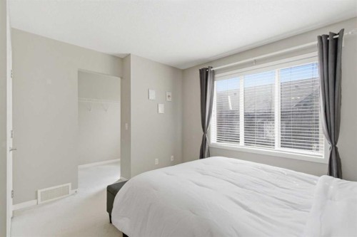 150 Copperpond Villas Se, Calgary, AB - Indoor Photo Showing Bedroom