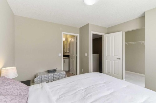 150 Copperpond Villas Se, Calgary, AB - Indoor Photo Showing Bedroom
