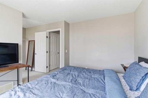 150 Copperpond Villas Se, Calgary, AB - Indoor Photo Showing Bedroom