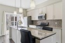 150 Copperpond Villas Se, Calgary, AB  - Indoor Photo Showing Kitchen With Double Sink With Upgraded Kitchen 