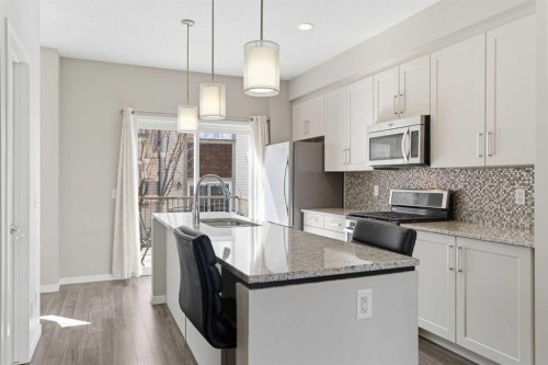 150 Copperpond Villas Se, Calgary, AB - Indoor Photo Showing Kitchen With Upgraded Kitchen
