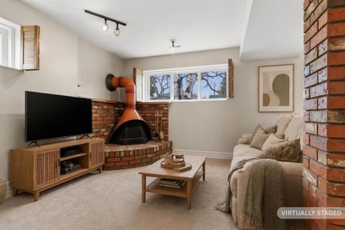 3816 Brighton Drive Nw, Calgary, AB - Indoor Photo Showing Living Room With Fireplace
