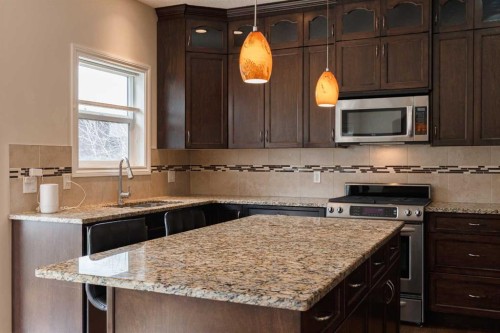 97 Aspenshire Drive Sw, Calgary, AB - Indoor Photo Showing Kitchen With Double Sink