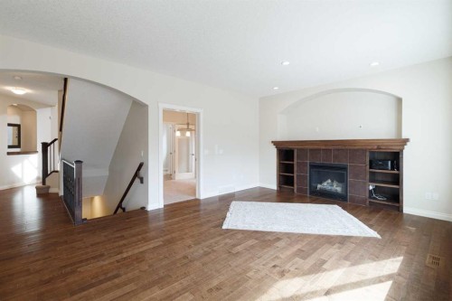 97 Aspenshire Drive Sw, Calgary, AB - Indoor Photo Showing Living Room With Fireplace