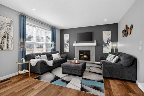37 Evansfield Manor Nw, Calgary, AB - Indoor Photo Showing Living Room With Fireplace