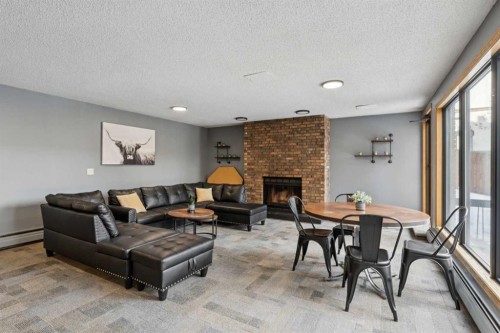 707-320 Meredith Road Ne, Calgary, AB - Indoor Photo Showing Living Room With Fireplace
