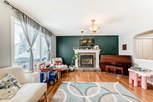 368 Cranfield Gardens Se, Calgary, AB - Indoor Photo Showing Living Room With Fireplace
