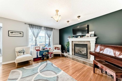 368 Cranfield Gardens Se, Calgary, AB - Indoor Photo Showing Living Room With Fireplace
