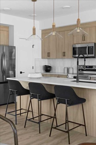 198 Greystone Boulevard, Cochrane, AB - Indoor Photo Showing Kitchen With Upgraded Kitchen