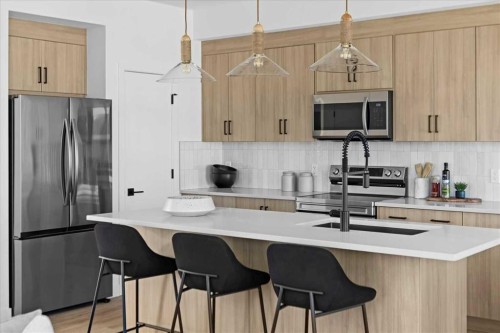 198 Greystone Boulevard, Cochrane, AB - Indoor Photo Showing Kitchen With Upgraded Kitchen