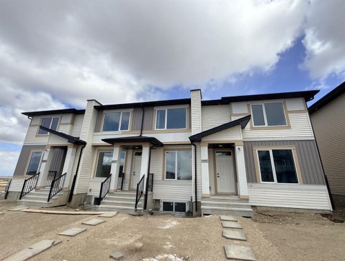 1995 Mccaskill Drive, Crossfield, AB - Outdoor With Facade