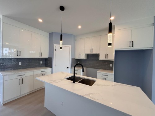 1995 Mccaskill Drive, Crossfield, AB - Indoor Photo Showing Kitchen With Double Sink With Upgraded Kitchen