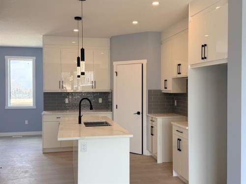 1995 Mccaskill Drive, Crossfield, AB - Indoor Photo Showing Kitchen With Double Sink