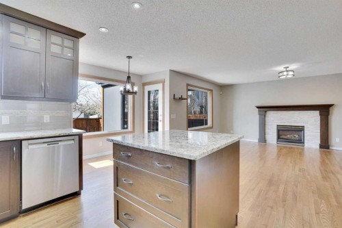 143 Country Hills View Nw, Calgary, AB - Indoor Photo Showing Kitchen With Fireplace