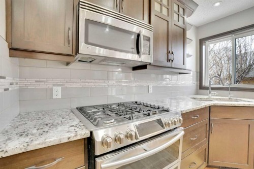 143 Country Hills View Nw, Calgary, AB - Indoor Photo Showing Kitchen With Upgraded Kitchen