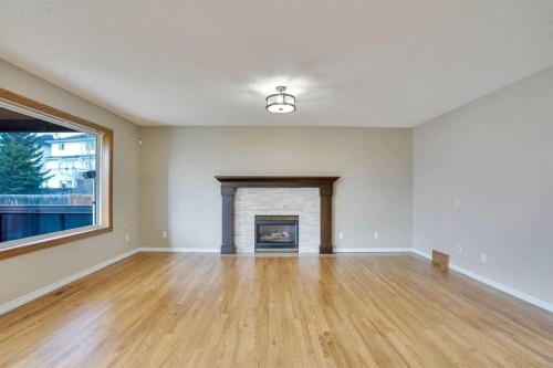 143 Country Hills View Nw, Calgary, AB - Indoor Photo Showing Living Room With Fireplace