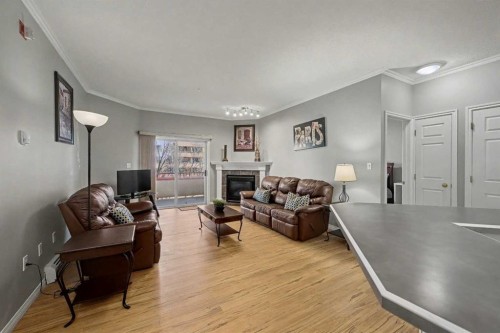 408-777 3 Avenue Sw, Calgary, AB - Indoor Photo Showing Living Room With Fireplace