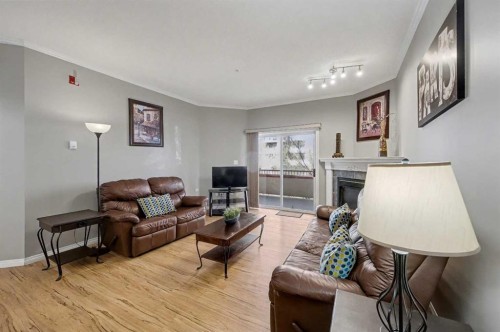 408-777 3 Avenue Sw, Calgary, AB - Indoor Photo Showing Living Room With Fireplace