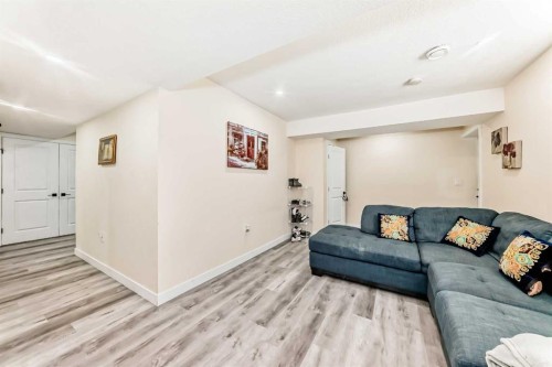 345 Marquis Landing Se, Calgary, AB - Indoor Photo Showing Living Room