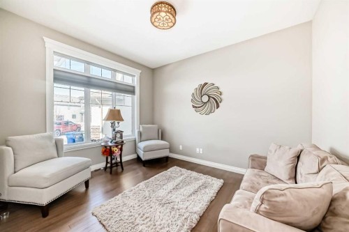 345 Marquis Landing Se, Calgary, AB - Indoor Photo Showing Living Room