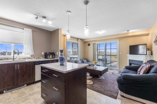 3306-279 Copperpond Common Se, Calgary, AB - Indoor With Fireplace