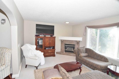 148 Scenic View Close Nw, Calgary, AB - Indoor Photo Showing Living Room With Fireplace