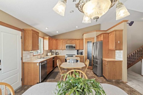 65 Canoe Circle Sw, Airdrie, AB - Indoor Photo Showing Kitchen With Stainless Steel Kitchen With Double Sink