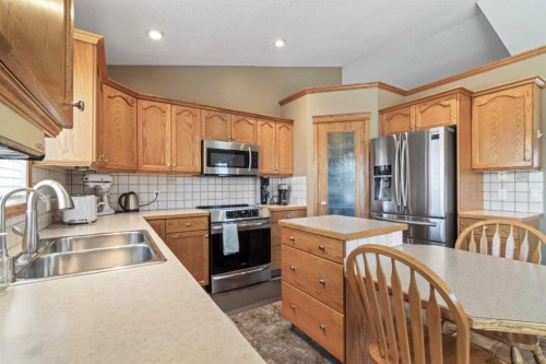 65 Canoe Circle Sw, Airdrie, AB - Indoor Photo Showing Kitchen With Stainless Steel Kitchen With Double Sink