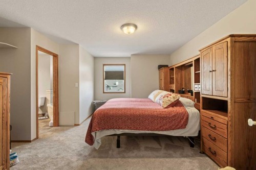 65 Canoe Circle Sw, Airdrie, AB - Indoor Photo Showing Bedroom