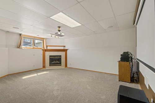 65 Canoe Circle Sw, Airdrie, AB - Indoor With Fireplace