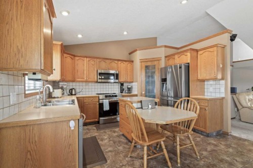 65 Canoe Circle Sw, Airdrie, AB - Indoor Photo Showing Kitchen With Stainless Steel Kitchen With Double Sink