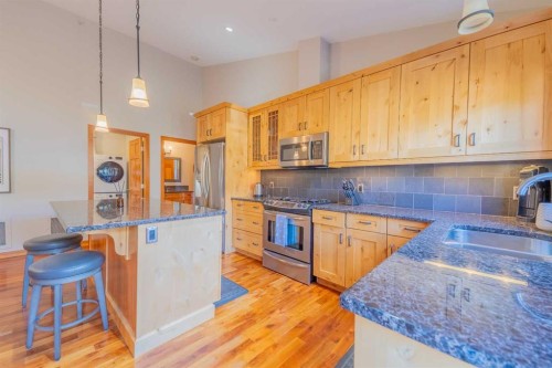 302-801 Benchlands Trail, Canmore, AB - Indoor Photo Showing Kitchen With Double Sink
