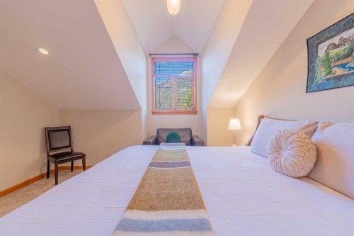 302-801 Benchlands Trail, Canmore, AB - Indoor Photo Showing Bedroom