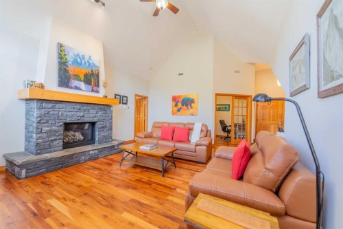 302-801 Benchlands Trail, Canmore, AB - Indoor Photo Showing Living Room With Fireplace