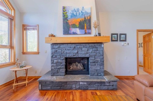 302-801 Benchlands Trail, Canmore, AB - Indoor Photo Showing Living Room With Fireplace