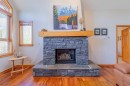 302-801 Benchlands Trail, Canmore, AB  - Indoor Photo Showing Living Room With Fireplace 